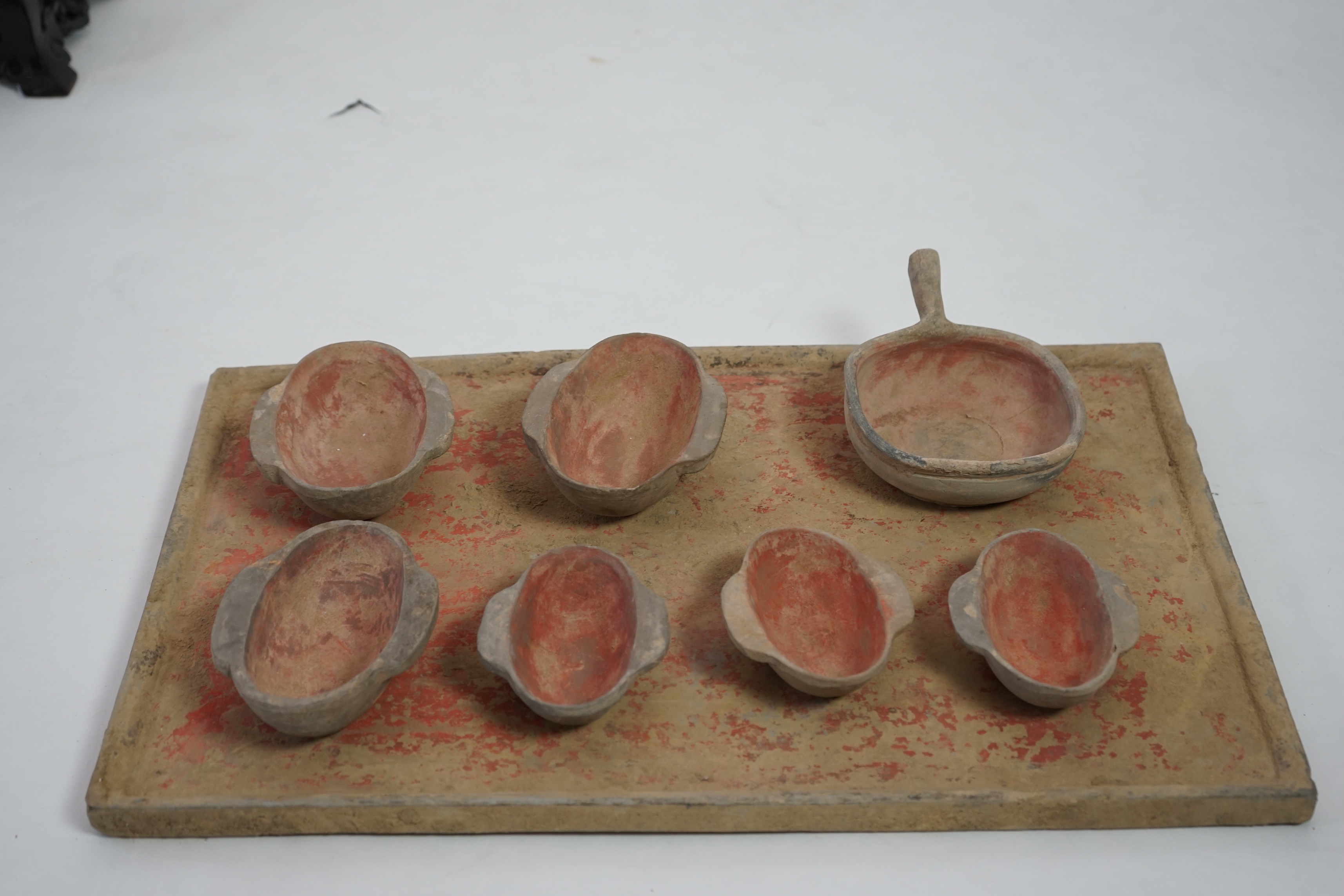 A large Chinese painted pottery tray, ladle and cups set, Han dynasty (206 BC-AD 220)